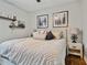 Cozy bedroom with neutral decor, decorative wall art, and comfortable furnishings at 5416 Twin Creeks Dr, Valrico, FL 33596
