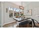 Elegant dining room with a wooden table set for dinner and a view of the screened in pool at 5416 Twin Creeks Dr, Valrico, FL 33596