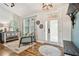 Bright entryway with hardwood floors, a stylish rug, and a glass-paneled front door at 5416 Twin Creeks Dr, Valrico, FL 33596
