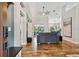 Spacious open concept living area with hardwood floors flowing into the kitchen and dining area at 5416 Twin Creeks Dr, Valrico, FL 33596