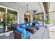 Relaxing covered patio with comfortable seating and stylish decor, perfect for outdoor living at 5416 Twin Creeks Dr, Valrico, FL 33596