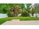 Green backyard featuring a privacy fence and mature trees at 5902 War Admiral Dr, Wesley Chapel, FL 33544