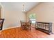 Bright dining area with a round table, wood chairs, and a view of the backyard at 5902 War Admiral Dr, Wesley Chapel, FL 33544