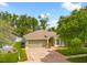 Charming single-story home with a well-manicured lawn and two-car garage at 5902 War Admiral Dr, Wesley Chapel, FL 33544