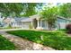 Inviting single-story home with landscaped front yard, two-car garage, and shade trees in a quiet neighborhood at 5902 War Admiral Dr, Wesley Chapel, FL 33544