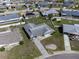Aerial view displays the property's roofline, landscaping, and the layout in relation to the surrounding neighborhood at 703 Bel Air Ave, Sun City Center, FL 33573