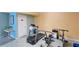 Well-equipped exercise room including a treadmill, stationary bike, and free weights for convenient home workouts at 719 Pinellas Bayway S # 309, Tierra Verde, FL 33715