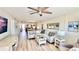Bright living room featuring contemporary furniture, stylish decor, and a ceiling fan at 719 Pinellas Bayway S # 309, Tierra Verde, FL 33715