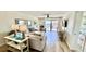 Cozy living room with sliding glass doors to a balcony at 719 Pinellas Bayway S # 309, Tierra Verde, FL 33715