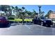 Well-maintained parking area with designated spaces and landscaping enhances the community's curb appeal at 719 Pinellas Bayway S # 309, Tierra Verde, FL 33715