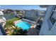 Inviting swimming pool surrounded by lush palm trees, offering a relaxing outdoor retreat at 719 Pinellas Bayway S # 309, Tierra Verde, FL 33715