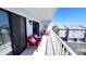 This relaxing balcony features stylish outdoor furniture and panoramic views of the surrounding landscape and neighborhood at 719 Pinellas Bayway S # 309, Tierra Verde, FL 33715