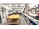 Spacious basement workshop area with multiple workbenches and ample storage at 719 Pinellas Bayway S # 309, Tierra Verde, FL 33715
