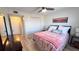Comfortable bedroom featuring wood flooring, ample closet space, and a calming color palette at 719 Pinellas Bayway S # 309, Tierra Verde, FL 33715