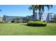 Low-rise condominium with beautiful landscaping and plenty of parking for residents and guests at 719 Pinellas Bayway S # 309, Tierra Verde, FL 33715