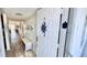 Condo entryway with charming décor and bench seating at 719 Pinellas Bayway S # 309, Tierra Verde, FL 33715