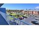 View of the community from a condo balcony with buildings, tennis courts and parking at 719 Pinellas Bayway S # 309, Tierra Verde, FL 33715