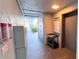 Hallway view leading to an elevator and outside, with mailboxes and fire extinguishers in view at 719 Pinellas Bayway S # 309, Tierra Verde, FL 33715