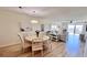 Open concept dining and living area with luxury vinyl flooring and lots of natural light at 719 Pinellas Bayway S # 309, Tierra Verde, FL 33715