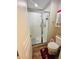 Bathroom shower with glass door and essentials storage at 724 15Th S Ave, St Petersburg, FL 33701
