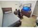 Bedroom featuring a twin bed, carpeting, and wood furniture at 724 15Th S Ave, St Petersburg, FL 33701
