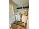 Bright laundry room featuring washer, dryer, and storage shelving with door to exterior at 724 15Th S Ave, St Petersburg, FL 33701