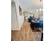Inviting living room and dining room with wood-look tile flooring, chandelier and ceiling fan at 724 15Th S Ave, St Petersburg, FL 33701