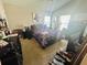 Vaulted ceiling primary bedroom with natural light, ceiling fan and windows at 724 15Th S Ave, St Petersburg, FL 33701