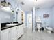Bright bathroom featuring sleek tile floors and modern fixtures at 7609 Barry Rd, Tampa, FL 33615