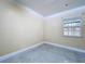 Small bedroom featuring sleek tile floors and bright natural light at 7609 Barry Rd, Tampa, FL 33615