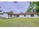 Charming single-story home with a well-maintained lawn and lovely curb appeal at 7609 Barry Rd, Tampa, FL 33615