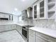 Modern kitchen features stainless steel appliances, beautiful countertops, and ample cabinet space at 7609 Barry Rd, Tampa, FL 33615
