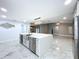 The kitchen showcases a large island with stainless steel appliances and ample counter space at 7609 Barry Rd, Tampa, FL 33615