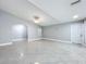 Spacious living area features gray walls, tile floors, and plenty of natural light for a warm ambiance at 7609 Barry Rd, Tampa, FL 33615