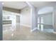 Open floorplan with views to kitchen and living room with french doors to pool at 7609 Barry Rd, Tampa, FL 33615