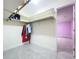 A functional walk-in closet with ample shelving and storage space for clothes at 7609 Barry Rd, Tampa, FL 33615