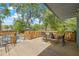 Enjoy outdoor dining on this wooden deck with a pool view and ample seating at 7708 N Arden Ave, Tampa, FL 33604