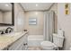 Bathroom with a vanity, granite countertops, and a shower-tub combination at 7708 N Arden Ave, Tampa, FL 33604