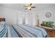 Bright bedroom with a queen-size bed and hardwood floors at 7708 N Arden Ave, Tampa, FL 33604