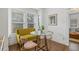 Cozy dining area featuring a table, chairs, and a banquette by a window at 7708 N Arden Ave, Tampa, FL 33604