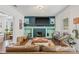Inviting living room featuring hardwood floors, stylish decor, and a modern fireplace at 7708 N Arden Ave, Tampa, FL 33604