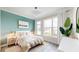 Bright bedroom with stylish accents, natural light, and a soothing color palette at 772 Gran Kaymen Way, Apollo Beach, FL 33572