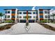 Stunning townhome exterior featuring modern design, lush landscaping, and a welcoming curb appeal at 772 Gran Kaymen Way, Apollo Beach, FL 33572