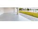 Spacious garage with speckled floor and water views at 772 Gran Kaymen Way, Apollo Beach, FL 33572