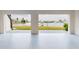 Spacious garage with speckled floor and water views at 772 Gran Kaymen Way, Apollo Beach, FL 33572