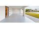 Spacious garage with speckled floor and water views at 772 Gran Kaymen Way, Apollo Beach, FL 33572