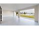 Spacious garage with speckled floor and water views at 772 Gran Kaymen Way, Apollo Beach, FL 33572