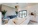 Stylish living room featuring modern furniture, neutral colors, and water view at 772 Gran Kaymen Way, Apollo Beach, FL 33572