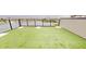 A rooftop deck offering stunning waterfront views and lush artificial turf at 772 Gran Kaymen Way, Apollo Beach, FL 33572