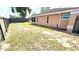 A large backyard with a fence, partial grass coverage, and privacy at 8054 Spring Hill Dr, Spring Hill, FL 34606